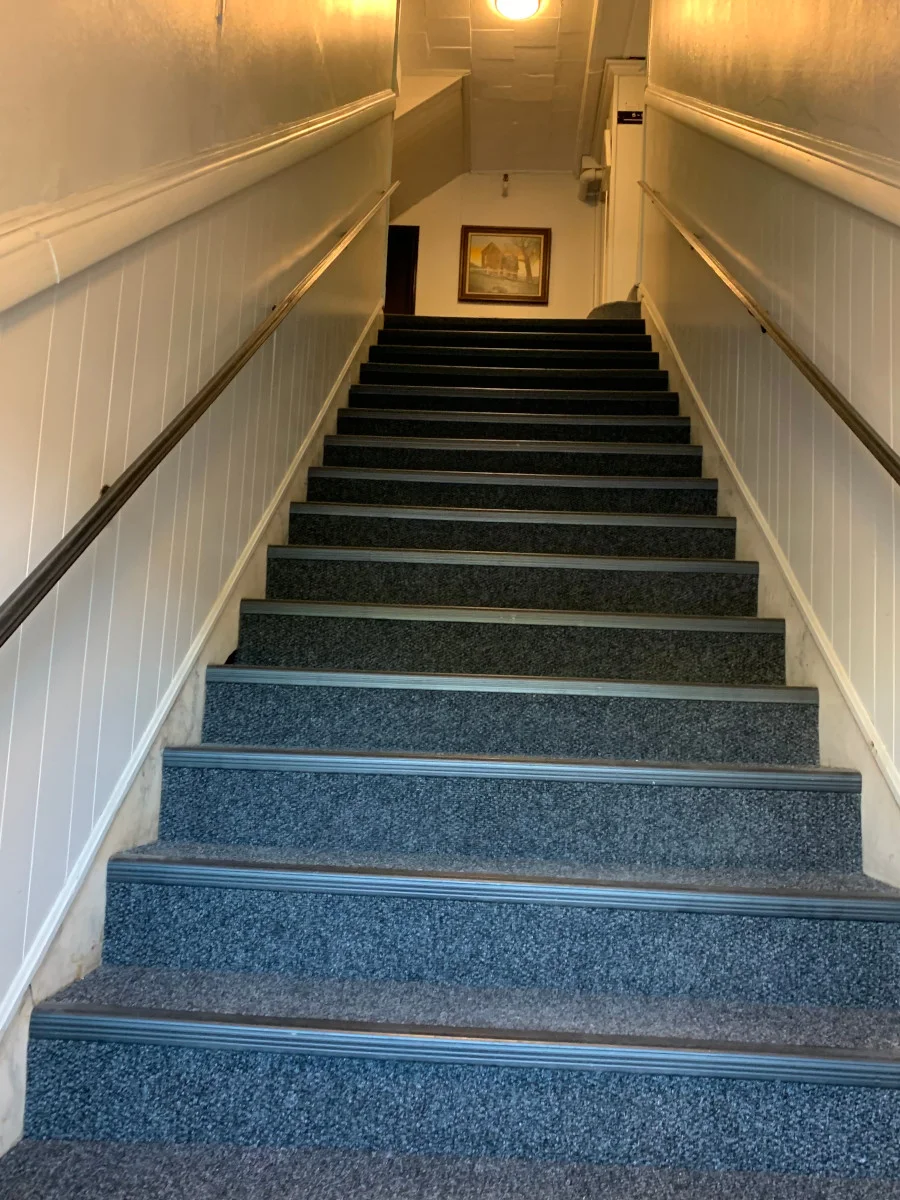 Our handyman installed custom rubber bullnose with high-wear carpeting for these stairs in Peabody, MA.

