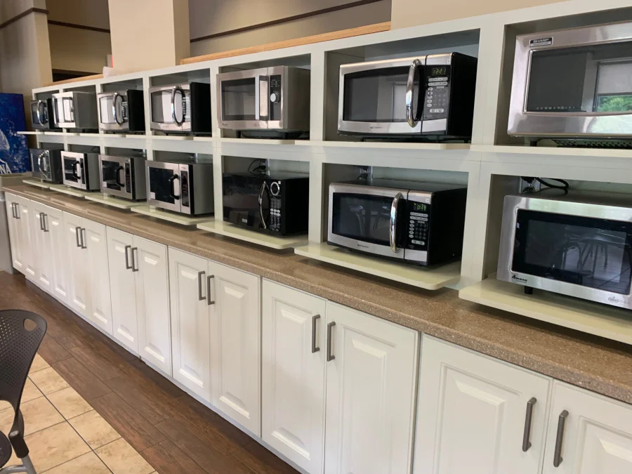 For this commercial setting in Lawrence, MA,  we designed and installed custom microwave cabinets.

