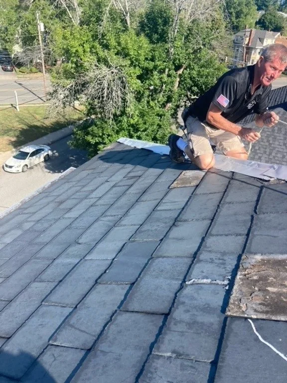 The crew from Northfield Handyman repaired the slate roof trim for this residence in Haverhill, MA.

