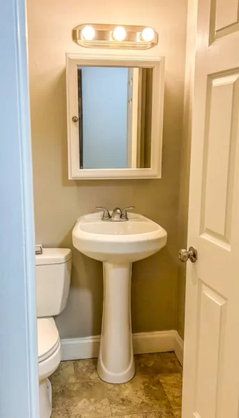 For this bathroom refinish in Peabody, MA., Northfield Handyman Services repaired and painted the wall. We then installed a new vanity mirror and lighting fixture.

